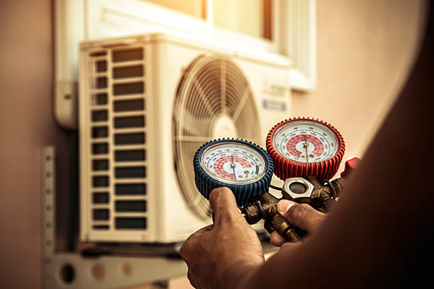 Professional Air Conditioning Service technician working in Spring City, UT